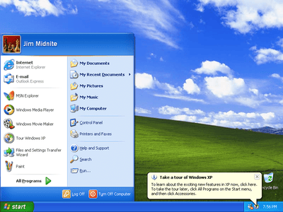 Microsoft Windows XP Professional software box featuring a blue design and logo with system requirements displayed.